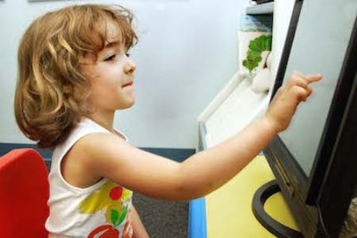 Child learning on a computer